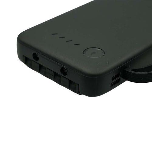 Black power bank device with ports on a white background