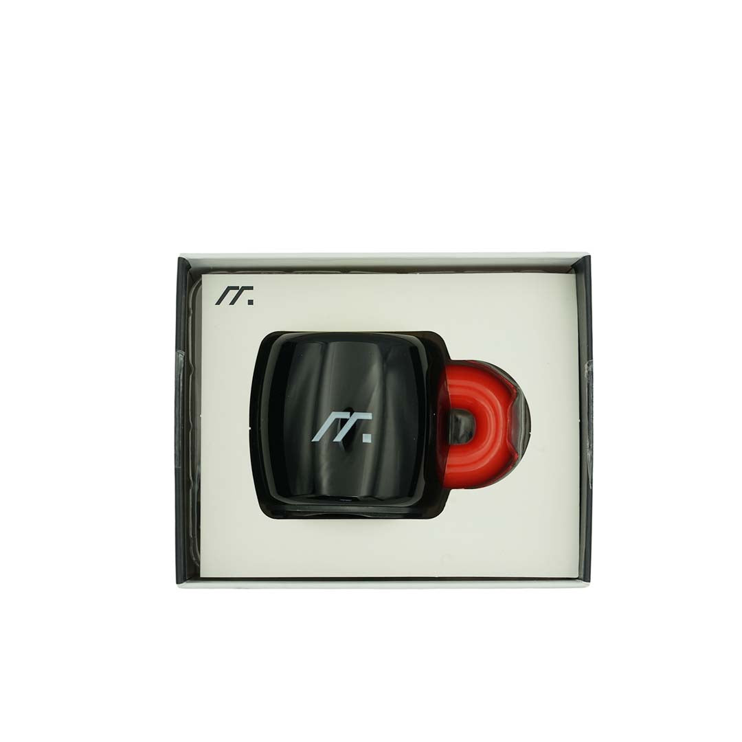Black and red Bluetooth spekaer device in a box with a logo on a white background